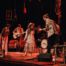 Burgeon concert in Theater Buitensoos, met muzikanten en band op het podium.